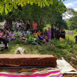 The community assembled at the gravesite